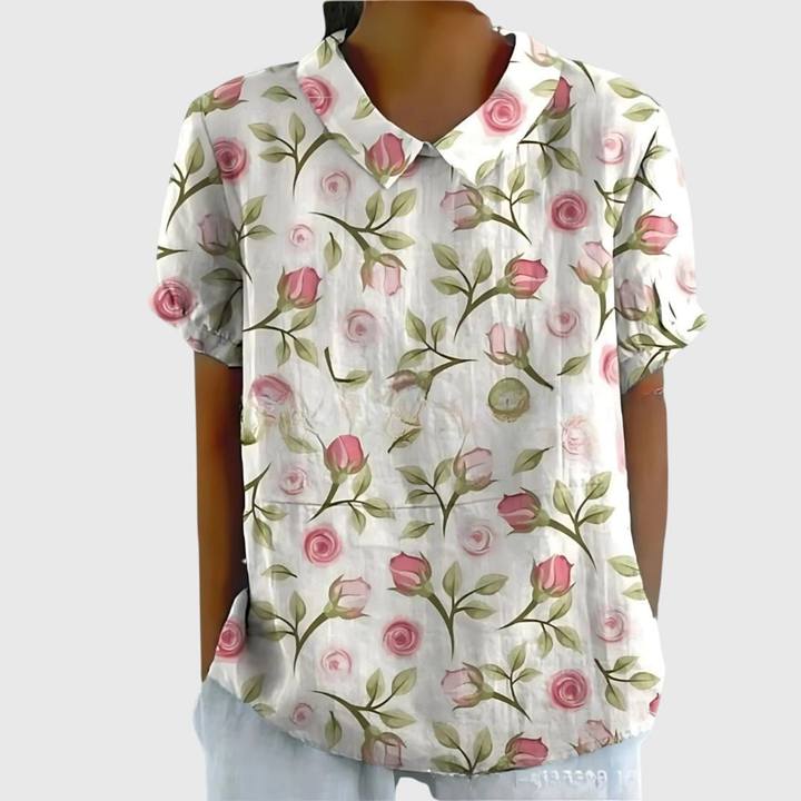 Stylish women's short sleeve blouse with a beautiful floral pattern, ideal for warm weather.