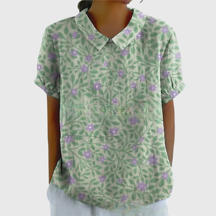 Vibrant floral print women's blouse, a lightweight summer top designed for comfort and style.