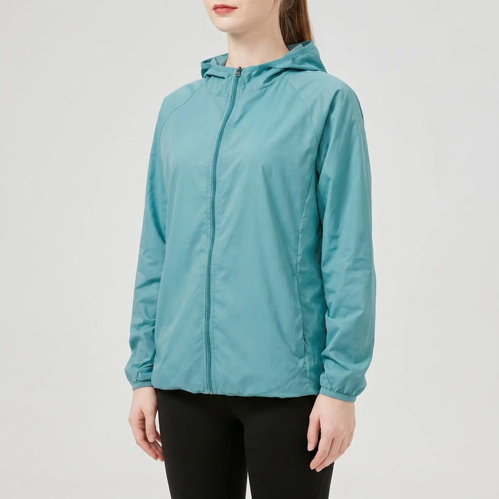 Versatile women's lightweight hooded jacket. A packable windbreaker, perfect for running, travel, & active outdoor wear.