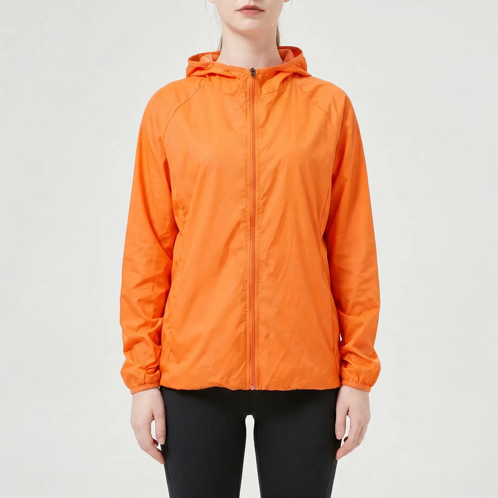 Performance women's lightweight hooded jacket. Essential activewear for running, hiking, and casual outdoor comfort.