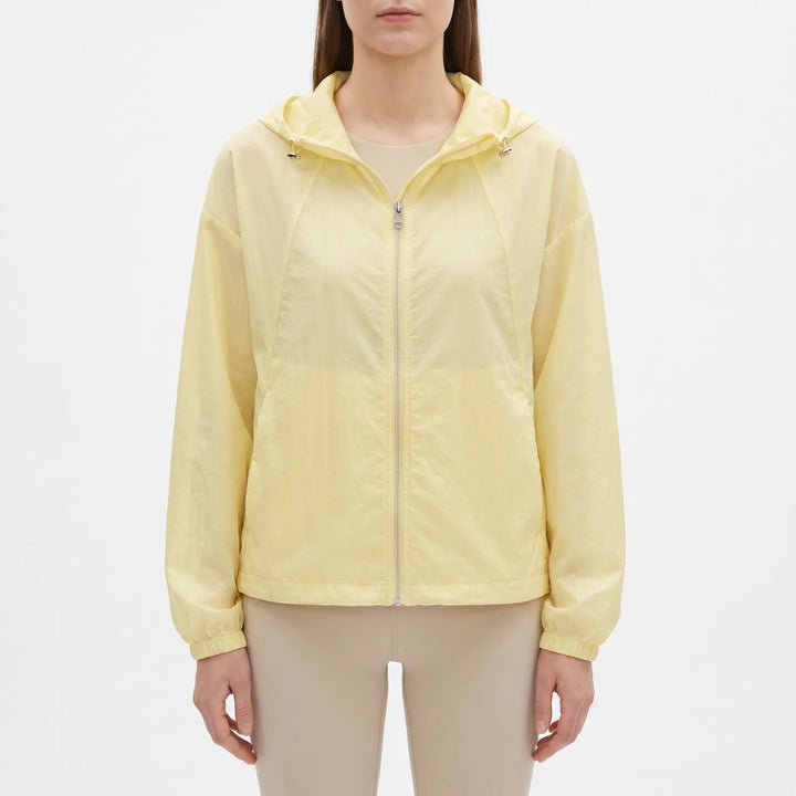 Sporty ladies hooded windbreaker, lightweight and perfect outerwear for casual activities in transitional weather.