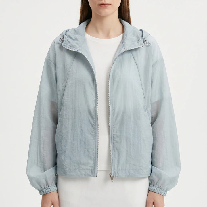 Vibrant pink women's lightweight hooded windbreaker, a versatile zippered jacket for active spring days.