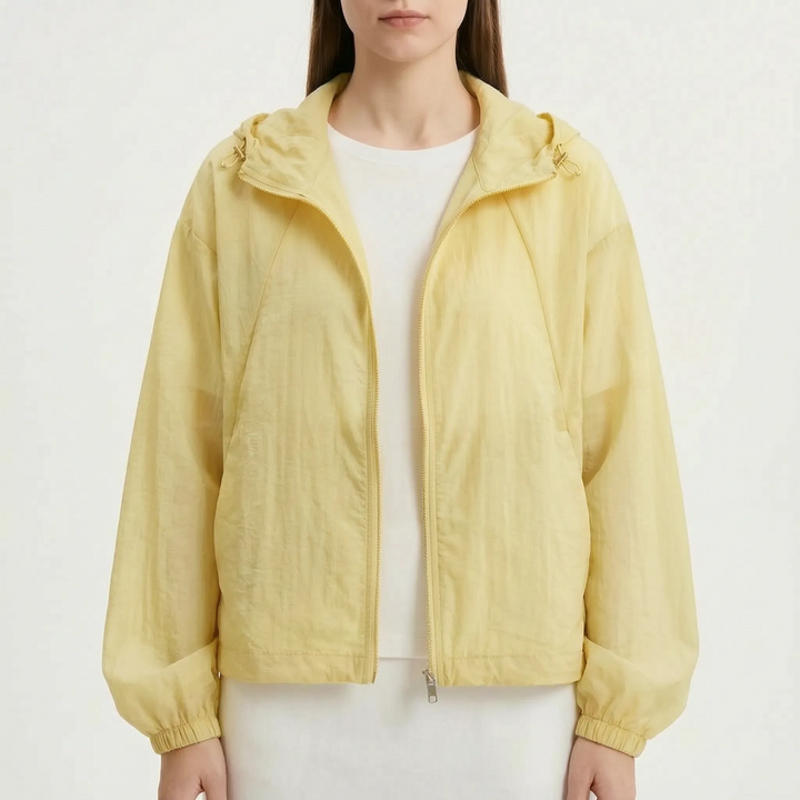 Comfortable women's lightweight hooded windbreaker jacket with full zipper, great for sporty casual wear.