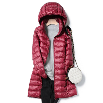 Hooded women's lightweight insulated jacket. Essential warm & stylish outerwear for cold fall & winter weather.