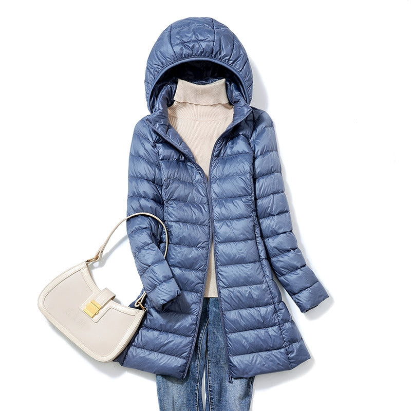 Cozy women's hooded insulated jacket, lightweight & warm. Perfect for travel & versatile fall/winter outerwear.