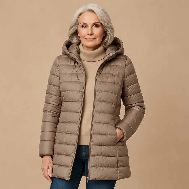Stylish women's lightweight insulated jacket with hood. Essential warm outerwear for travel, fall, and winter.