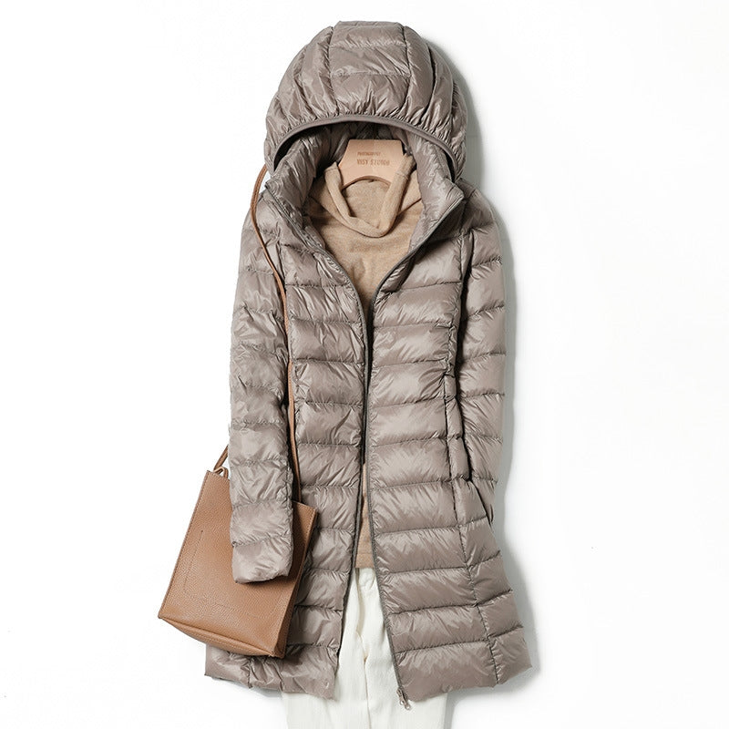 Versatile women's insulated jacket, hooded & lightweight. Keeps you warm in fall/winter outdoor adventures.