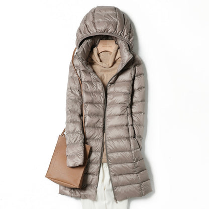 Versatile women's insulated jacket, hooded & lightweight. Keeps you warm in fall/winter outdoor adventures.