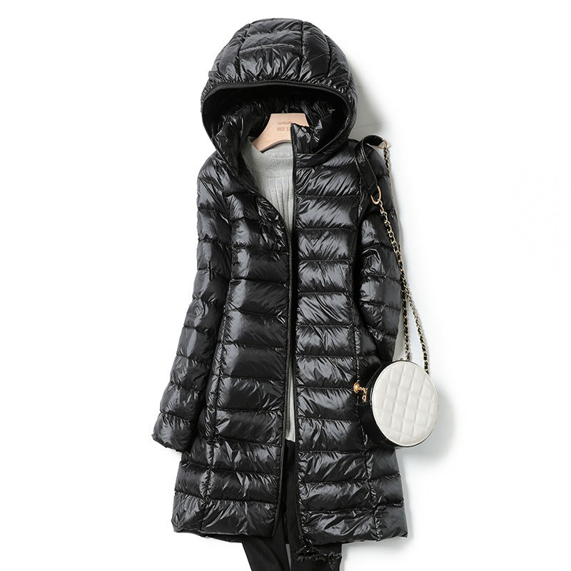 Women's insulated hooded jacket, lightweight & cozy. Perfect for travel, fall, and winter outdoor adventures.