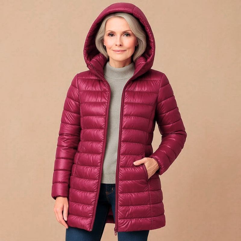 Warm women's insulated lightweight jacket with hood. Versatile outerwear for winter, fall, and outdoor activities.