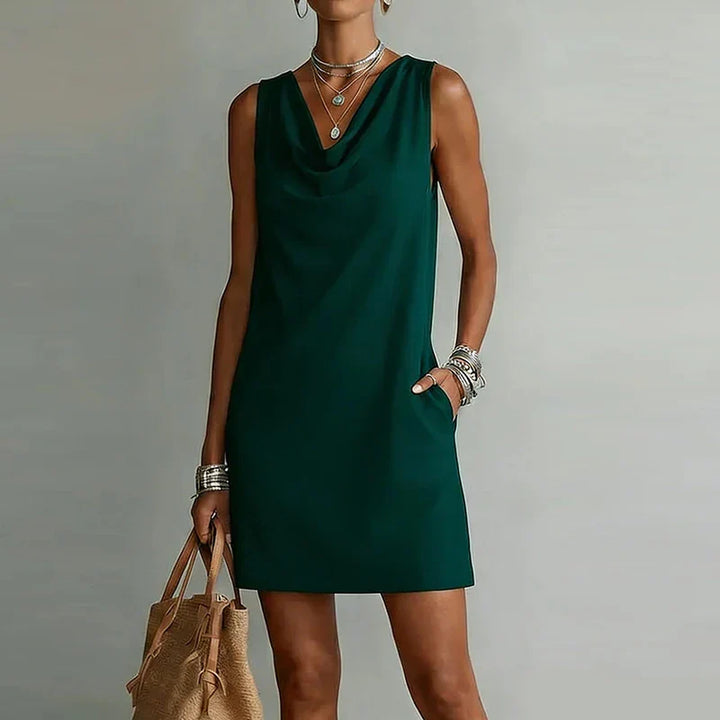 Women's lightweight mini dress with draped neckline, relaxed fit & pockets, perfect for casual summer wear.