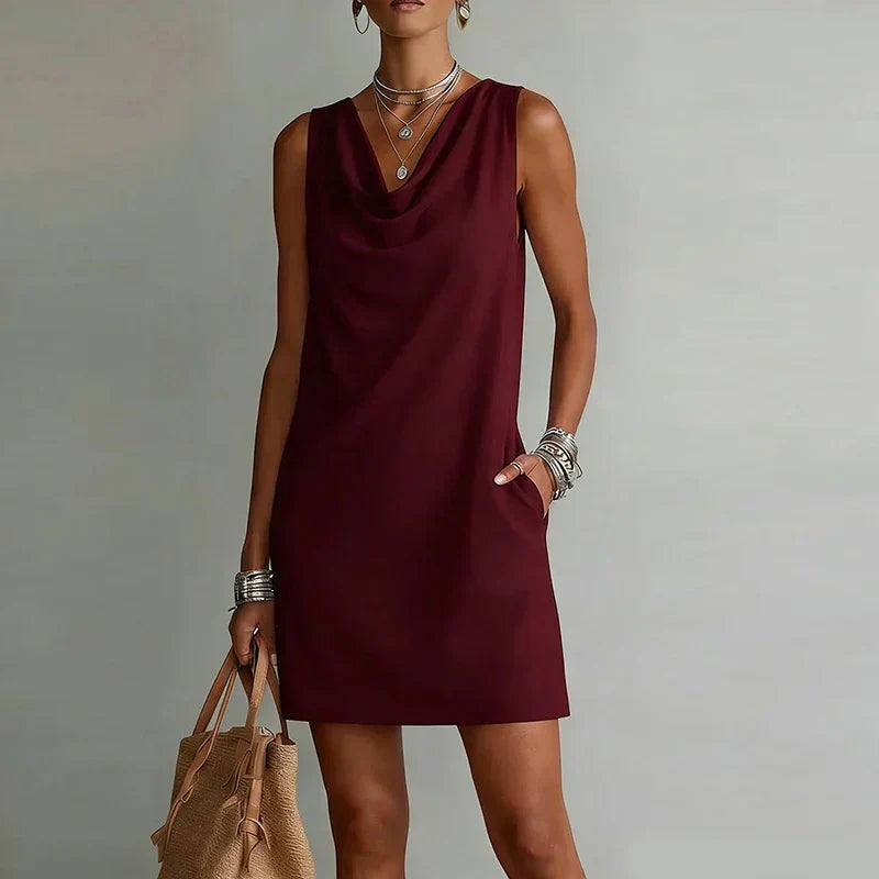 Casual women's mini dress, sleeveless, featuring a relaxed fit, practical pockets & stylish draped neckline.