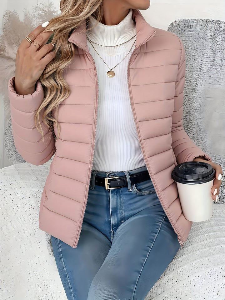 Lightweight quilted women's jacket. Stand collar, full zip, slim fit. Versatile casual outerwear for fall/winter.