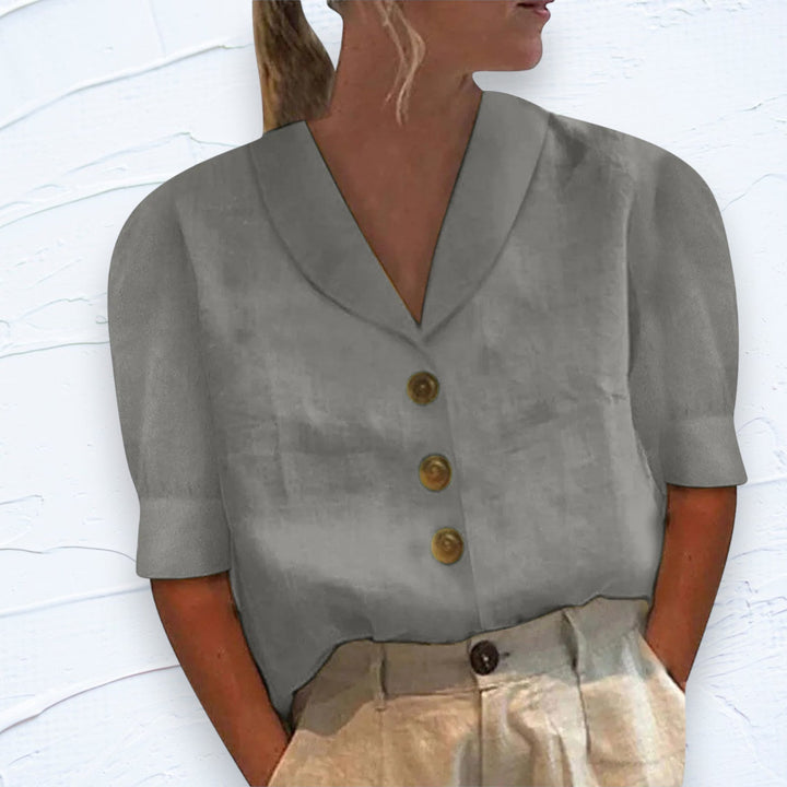 Chic women's short sleeve button-front top for versatile fashion, ideal for everyday wear or a summer look.