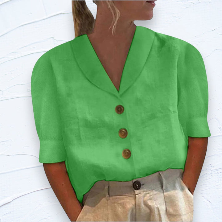 Stylish women's short sleeve button-front shirt, an essential casual top for a relaxed and chic summer outfit.