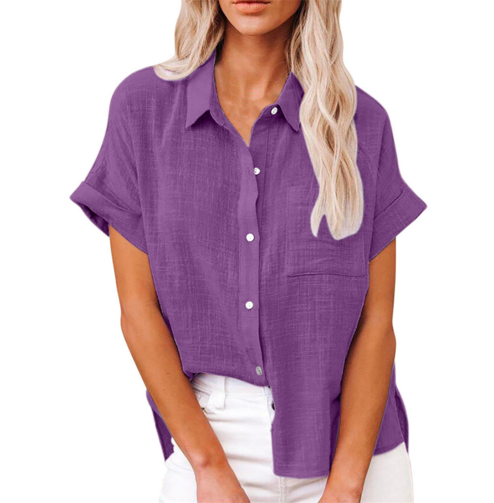 Close-up of a women's casual short sleeve button-up shirt, highlighting the front pocket & fabric.