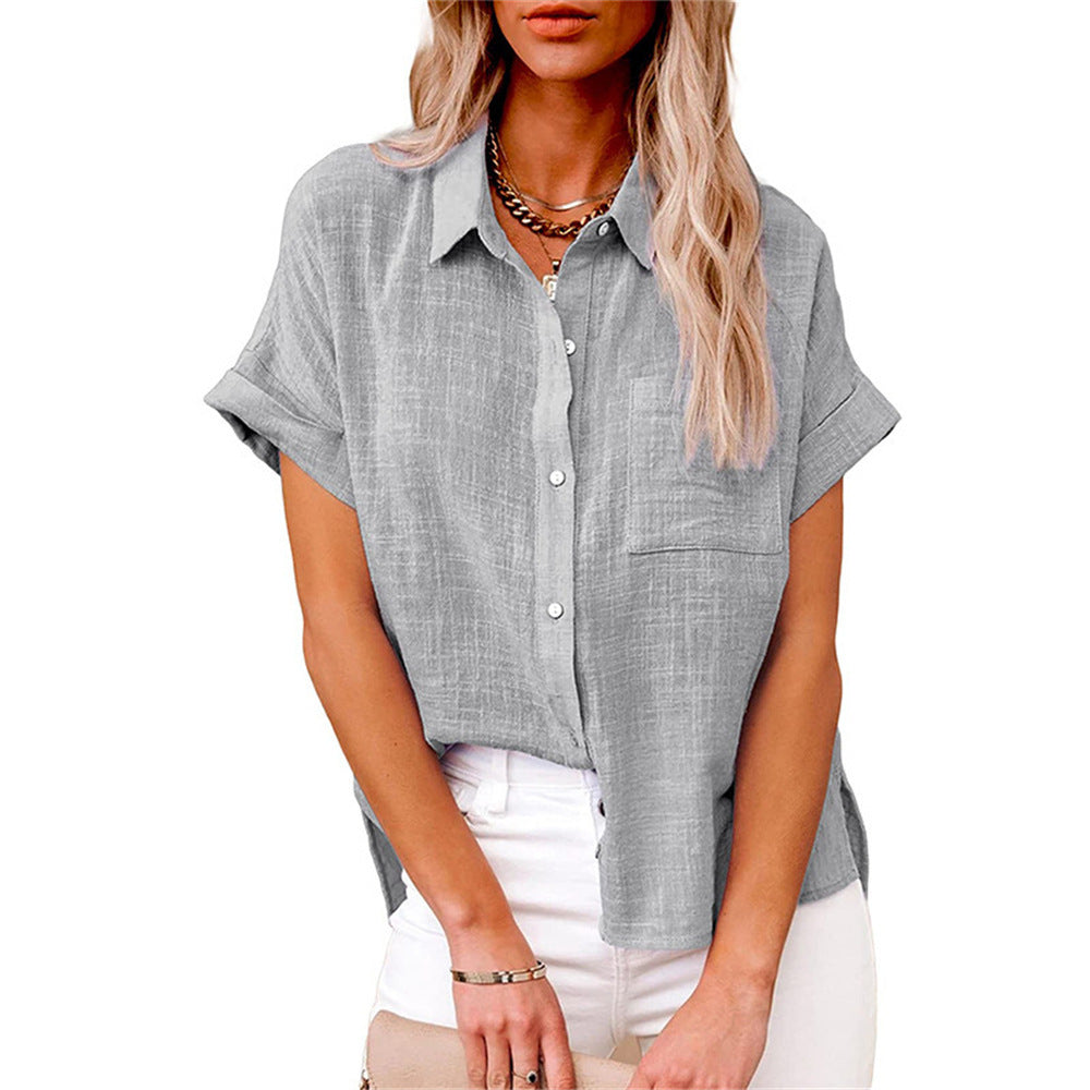 Stylish women's summer blouse with short sleeves and a practical front pocket. Relaxed fit top.