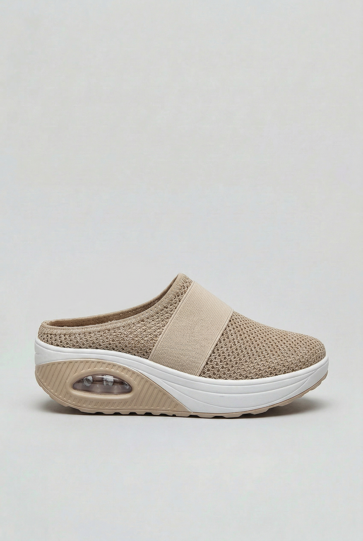 Women's lightweight slip-on mules with air cushion for breathable all-day comfort.