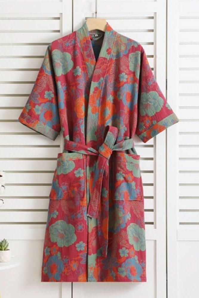 Breathable women's lightweight soft bathrobe with pockets & tie belt for ultimate home lounging.