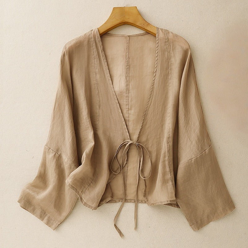 Elegant women's tie-front cardigan, lightweight and long-sleeved, ideal for casual and fashion-forward layering.