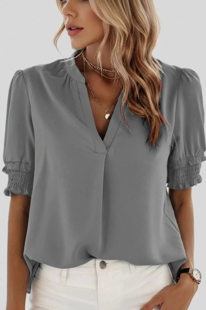 Versatile women's V-neck puff sleeve blouse. Lightweight for summer, elegant for office, or casual chic styling.