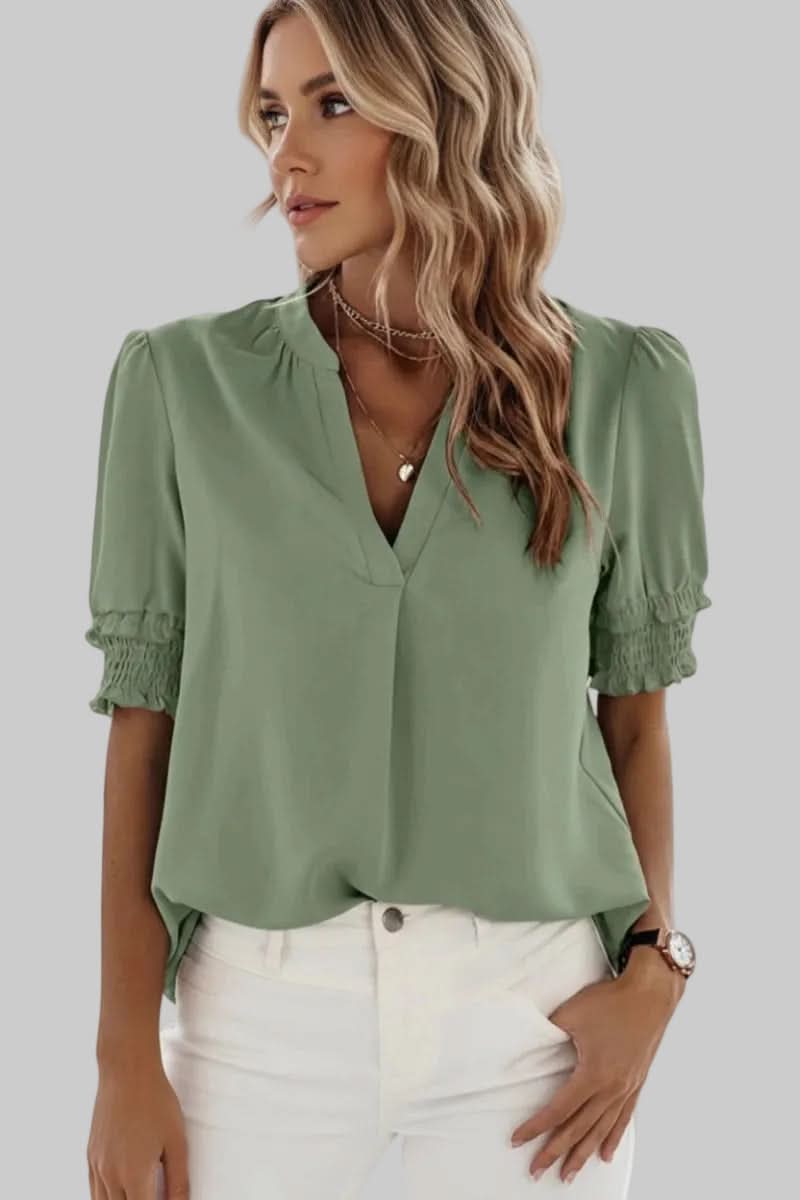 Fashionable lightweight V-neck blouse for women. On-trend puff sleeves create an elegant and versatile casual chic top.