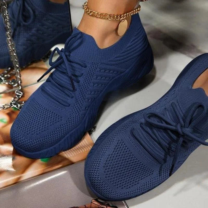 Close-up of flexible, breathable fabric on women's lightweight walking shoes, ensuring comfort.