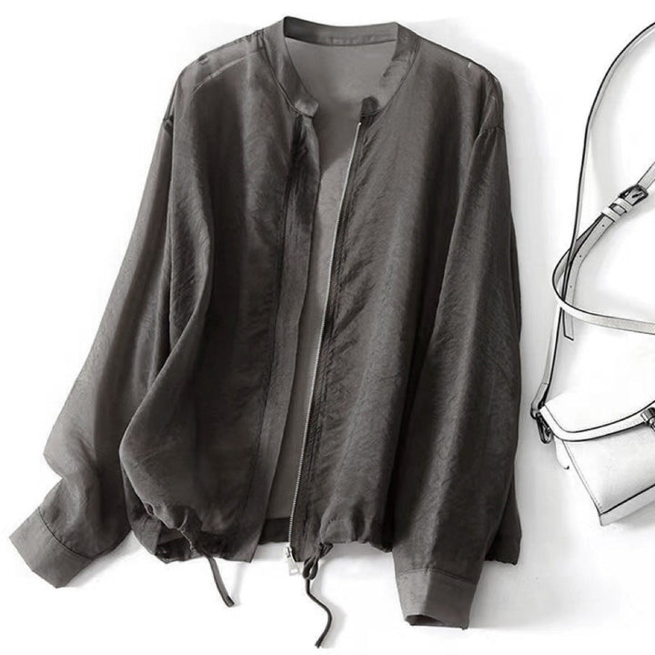 Stylish gray women's lightweight jacket, perfect for spring & summer. Adjustable, relaxed fit, versatile casual outerwear.