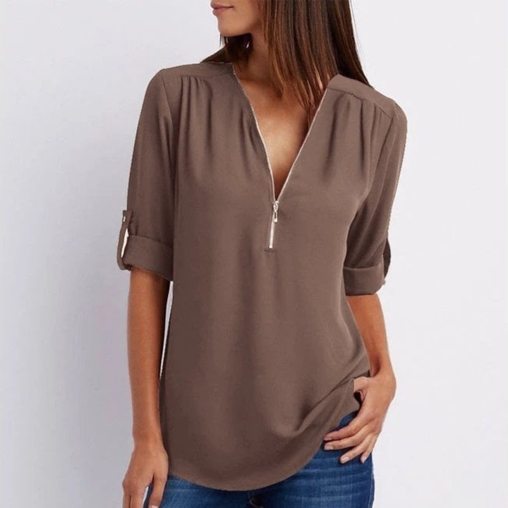 Lightweight women's V-neck top, featuring a zip front and chic roll-sleeves. Great for all-year casual style.