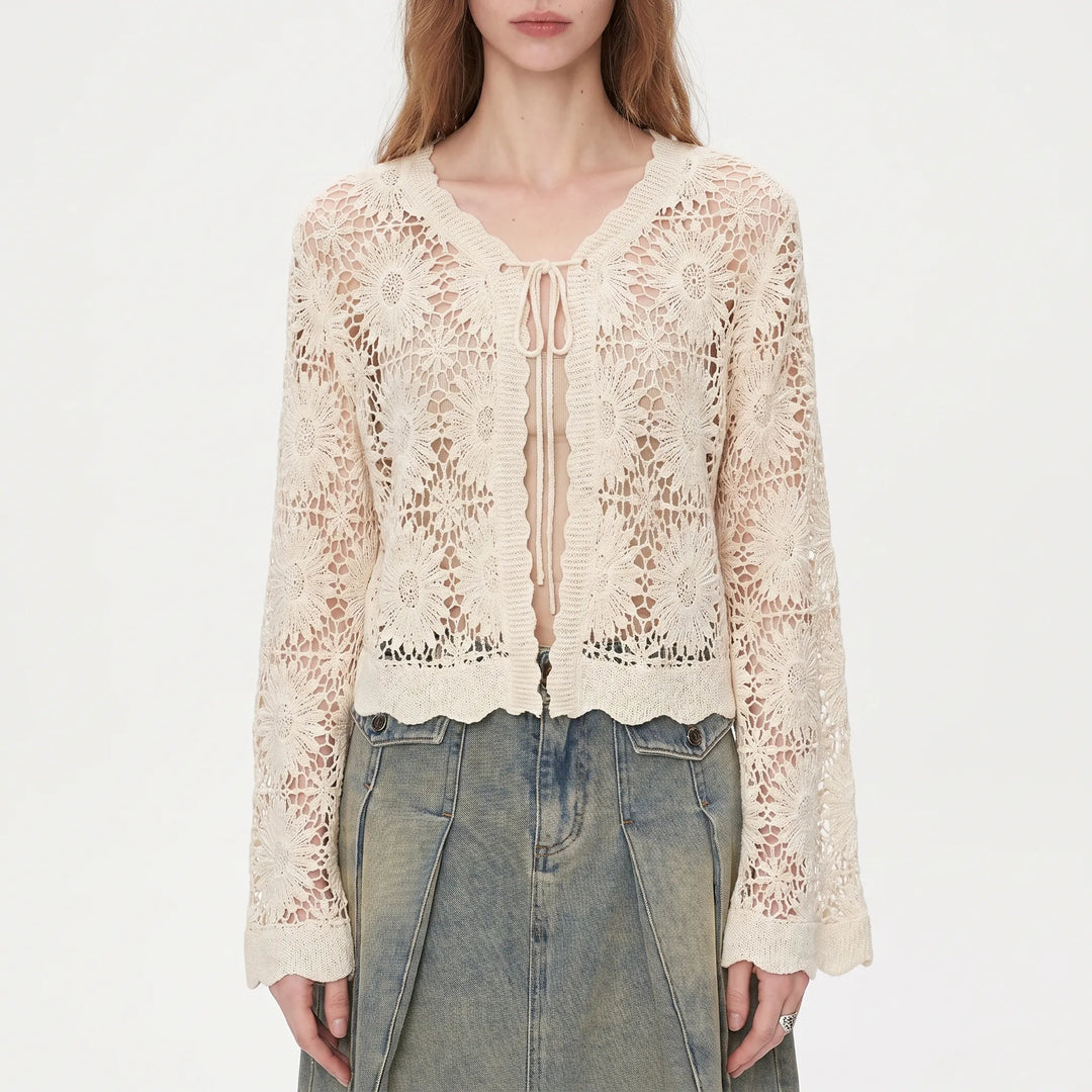 Bohemian style women's lilac floral openwork cardigan. Features bell sleeves & tie front, perfect summer layer.