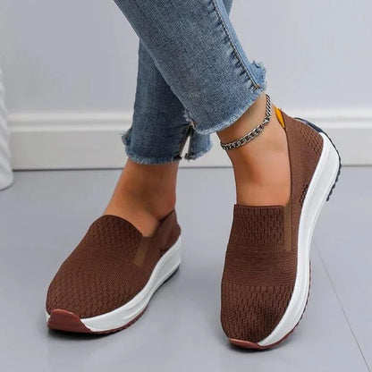 Woman walking in comfortable Liora Flex slip-on knit shoes, ideal for daily casual wear & light activity.