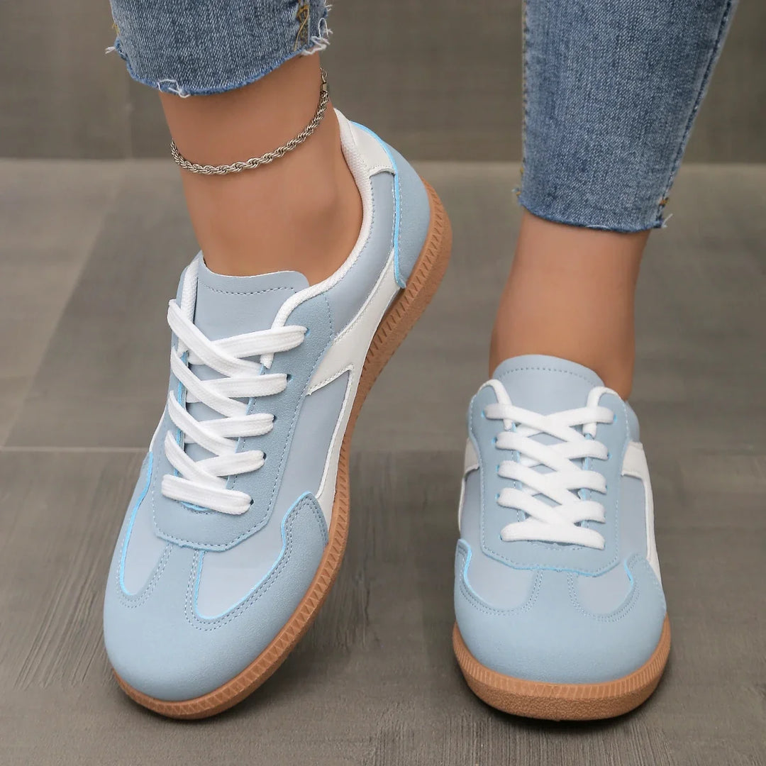 Black Livia vintage-inspired women's sneakers. Versatile low-profile retro footwear for casual lifestyle comfort.