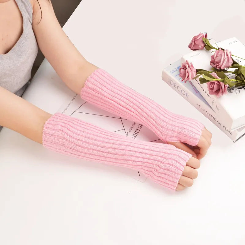 Women's long fingerless knitted winter gloves, cozy and stylish arm warmers.