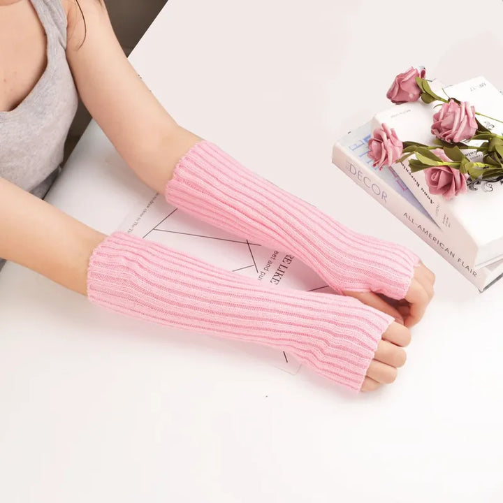 Women's long fingerless knitted winter gloves, cozy and stylish arm warmers.