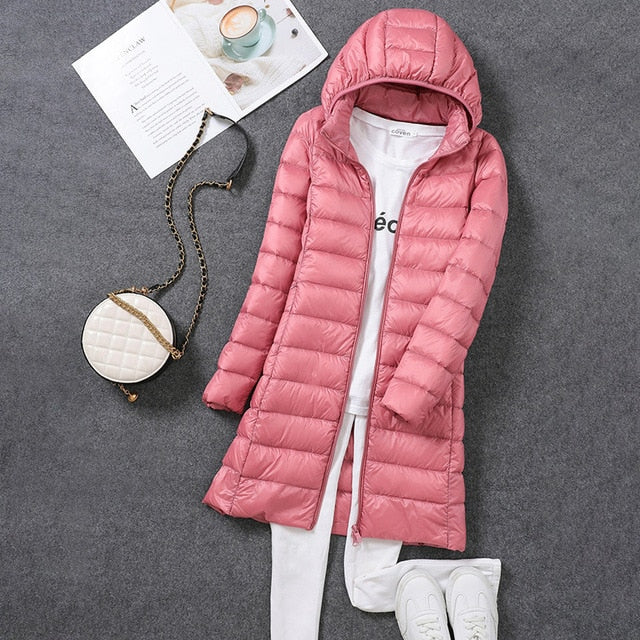 New women's long hooded puffer coat, a stylish & warm winter fashion jacket.