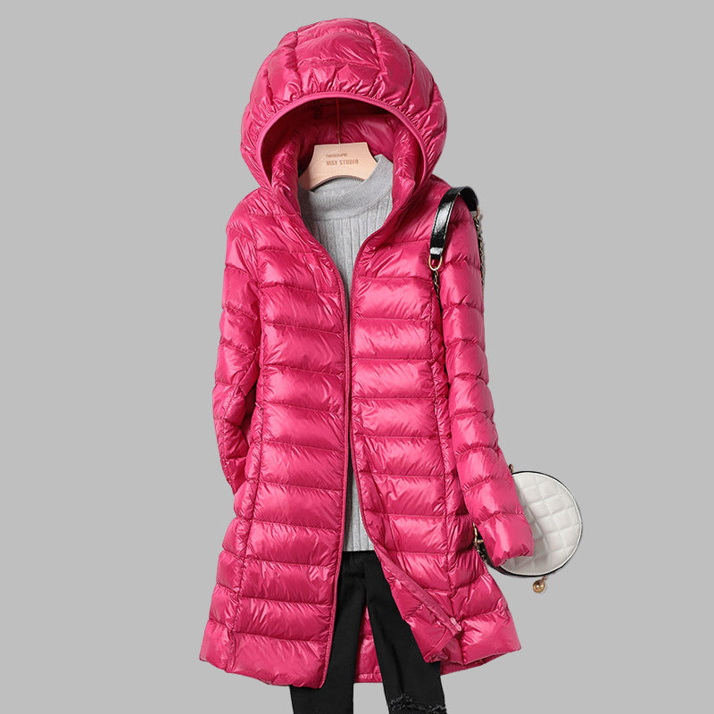 Women's cozy hooded long puffer coat, fashionable winter outerwear providing warmth & comfort.