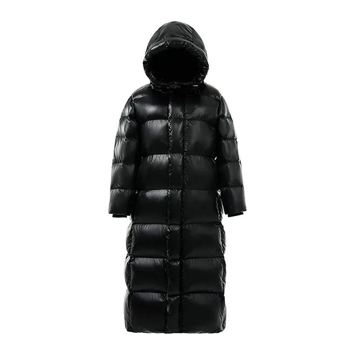 Stylish women's maxi quilted winter coat with hood. Full-length padded jacket for cold weather fashion.