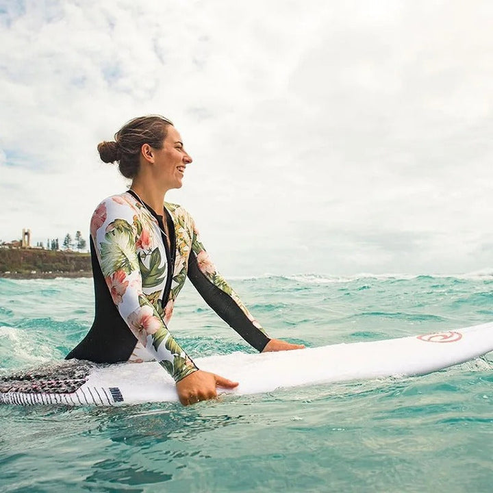 Athletic long sleeve one-piece swimsuit for women, perfect for active swimming, surfing, or beach sports.