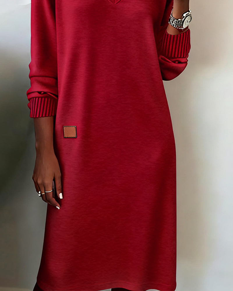 Midi length long sleeve V-neck dress for women. A versatile choice for office, fall, or casual wear.