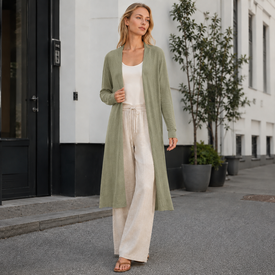 Female model wearing a versatile long knit cardigan, suitable for casual or dressy outfits.