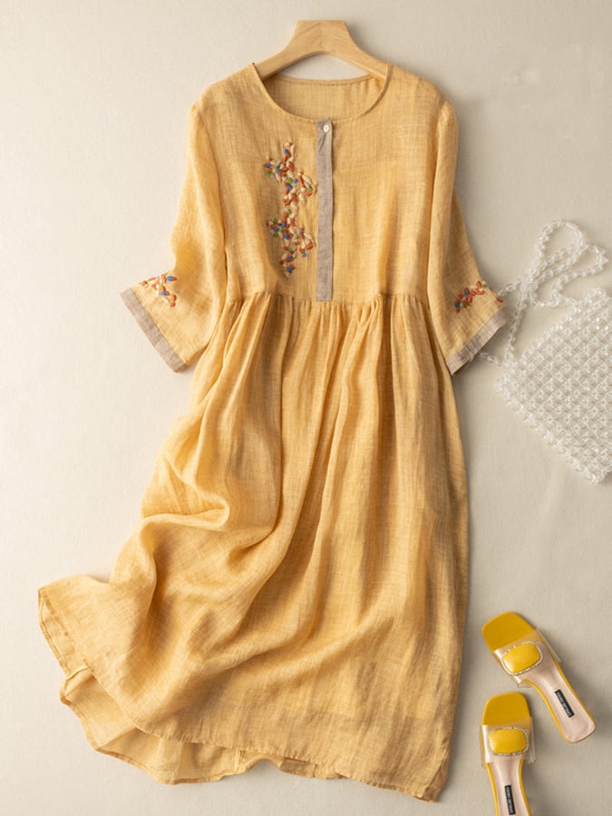 Women's loose fit boho midi dress with intricate embroidery, ideal for summer casual style.