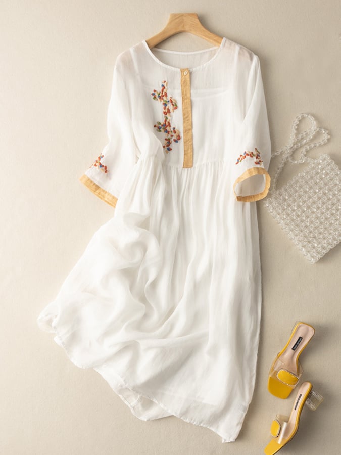 Boho midi dress for women, featuring intricate embroidery and a comfortable loose fit, great for summer.