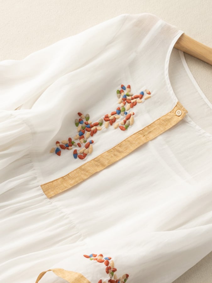 Woman wearing a flowing, comfortable women's embroidered boho midi dress, perfect for summer casual outings.