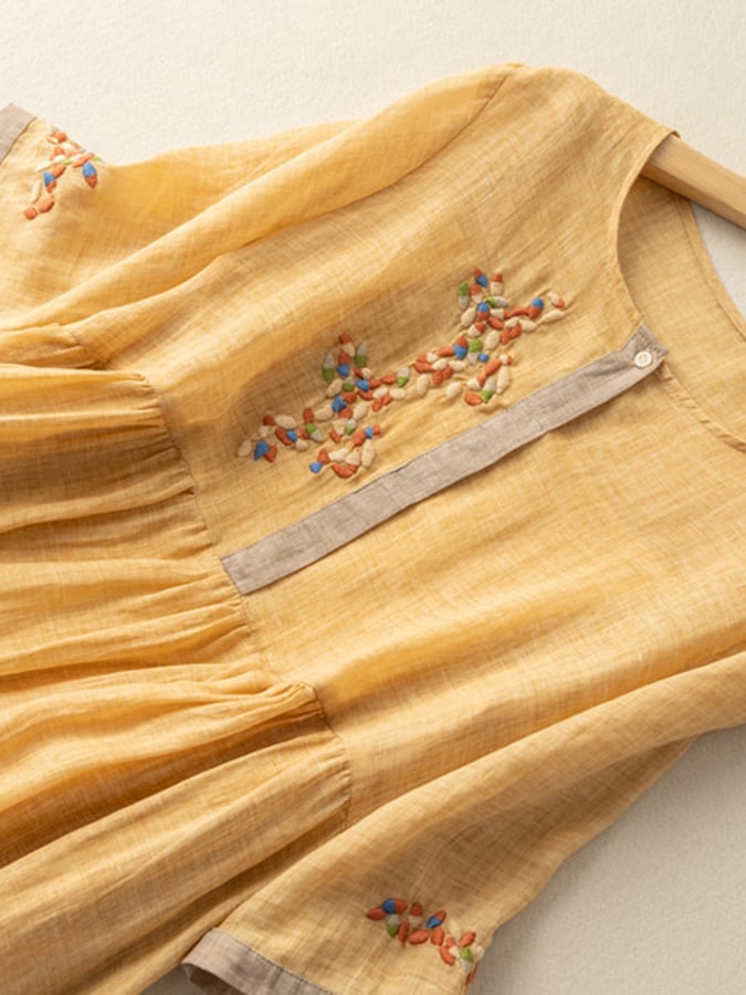 Casual women's summer midi dress, loose fit with elegant embroidery and a distinct bohemian style.