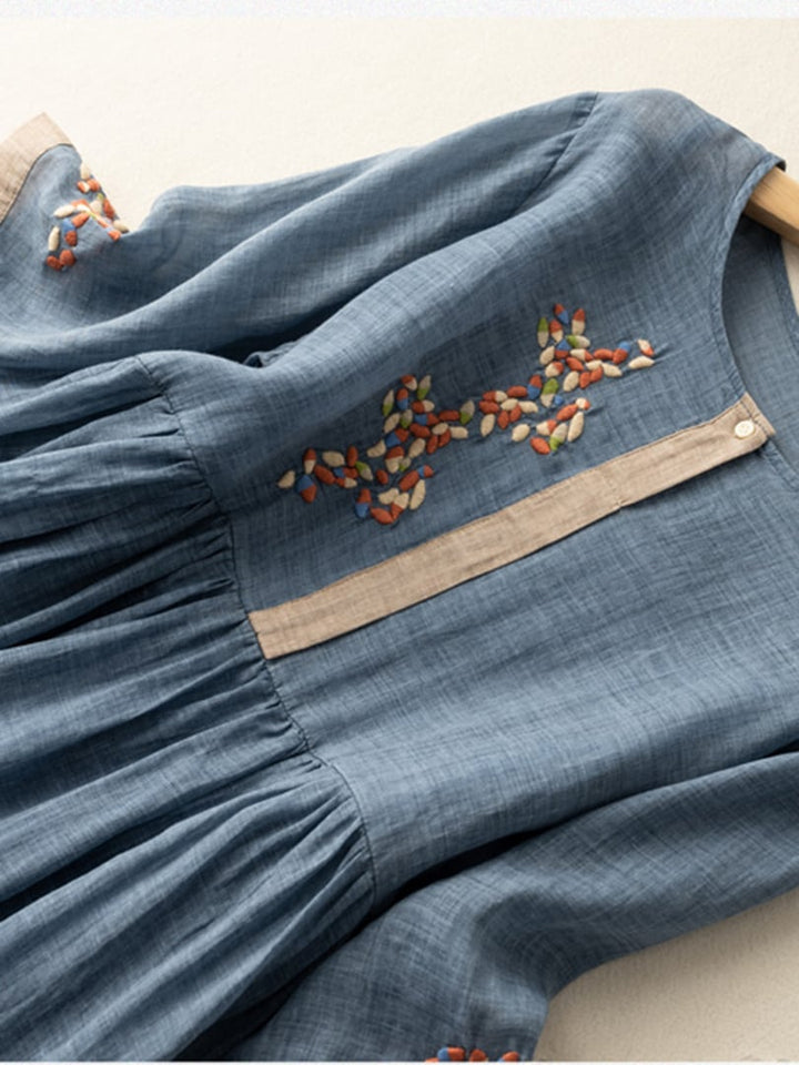 Flared women's boho midi dress with intricate embroidery and a comfortable loose fit for chic summer style.