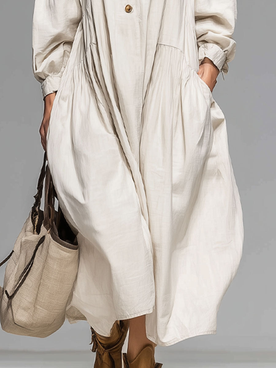Stylish women's loose fit midi dress with long sleeves and a round neck, ideal for spring or fall everyday fashion.