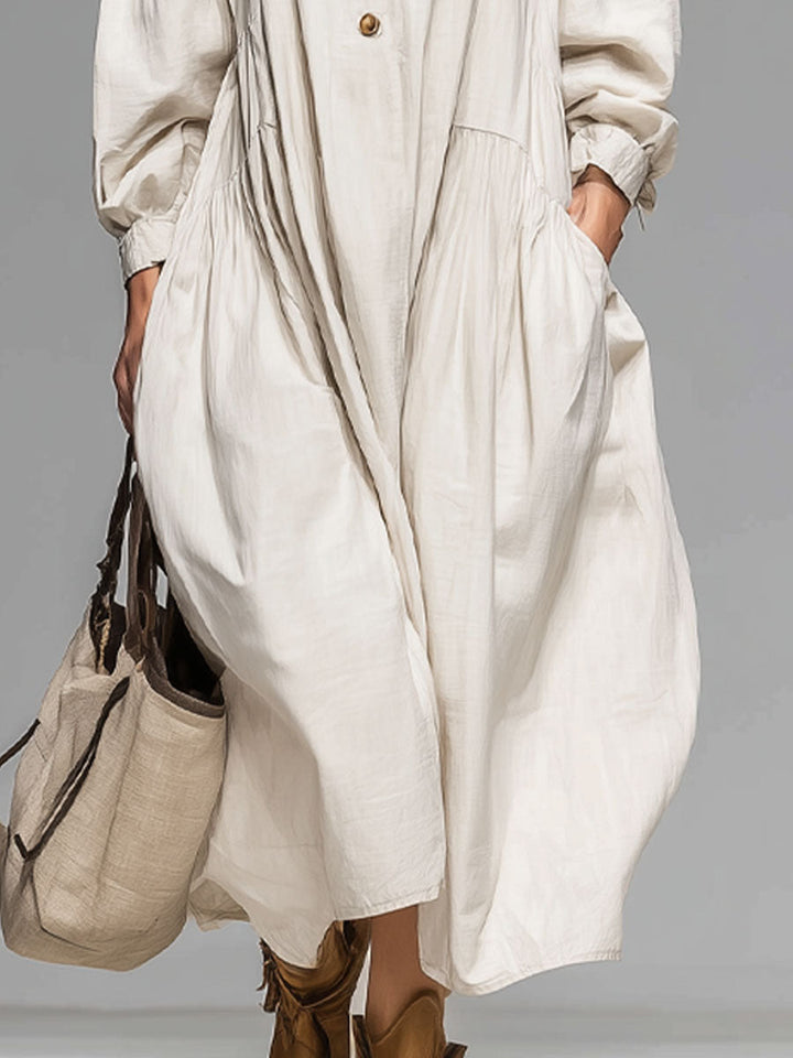 Stylish women's loose fit midi dress with long sleeves and a round neck, ideal for spring or fall everyday fashion.