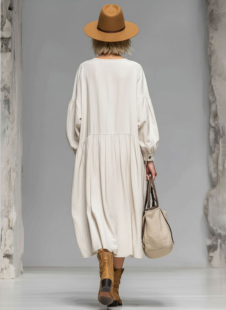 Versatile women's long-sleeved midi dress, loose fit with button front and pockets. Great for casual day wear.