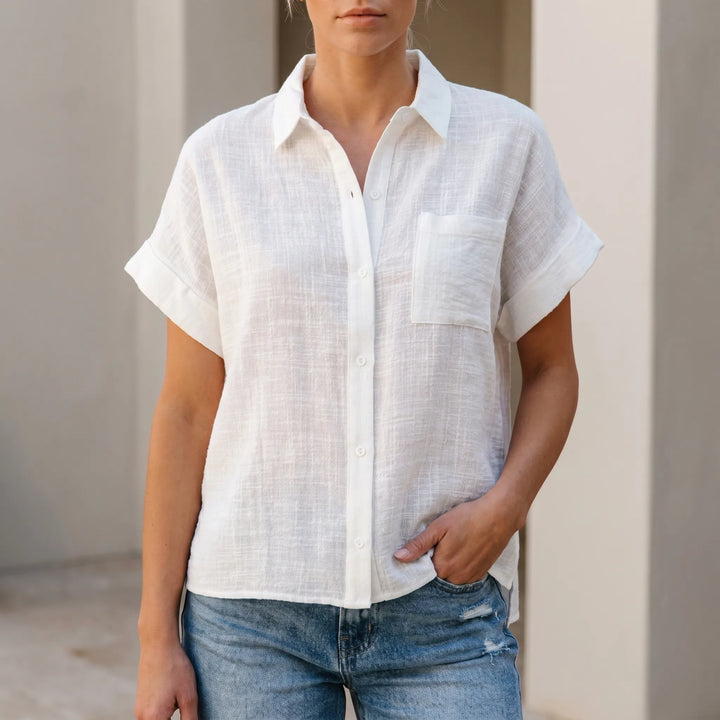 Women's loose fit short sleeve button-down shirt, casual and comfortable for summer days.