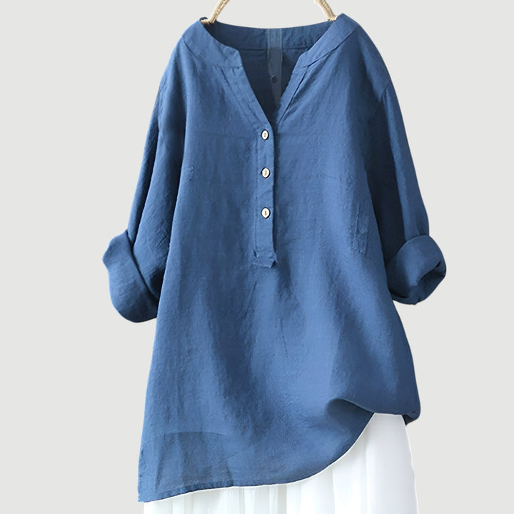 Fashionable women's loose fit V-neck blouse, suitable for stylish workwear or comfortable casual outfits.